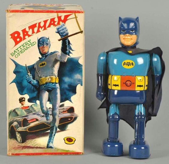 Vintage Batman robot toy standing next to its illustrated original box