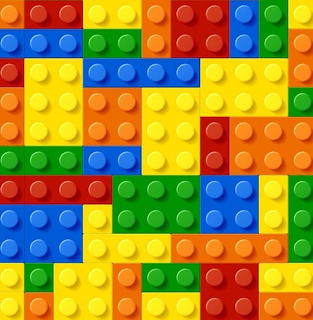 Colorful plastic building blocks with circular studs arranged in a mosaic pattern