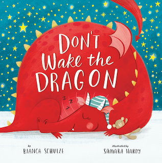 Illustration of a sleeping red dragon in snow under a starry blue sky with text on its body