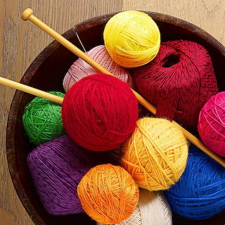 Colorful Yarn Balls with Knitting Needles