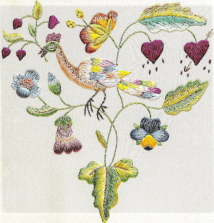 Embroidered white bird with colorful flowers, hearts, and butterfly on cream textile