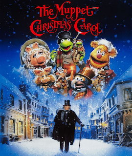 Muppet Christmas Carol movie poster with characters floating above snowy Victorian street and figure with cane