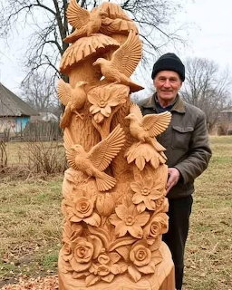 Man with Des Colombes Sculpture