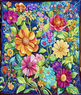 Colorful quilted floral garden with large vibrant flowers and green leaves on blue background