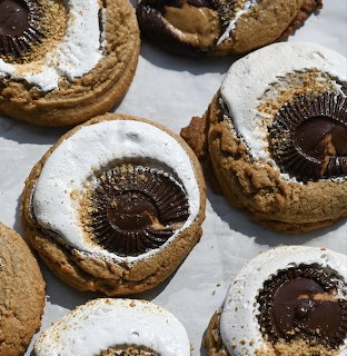 Close-up of cookies topped with toasted marshmallow and chocolate candy cups