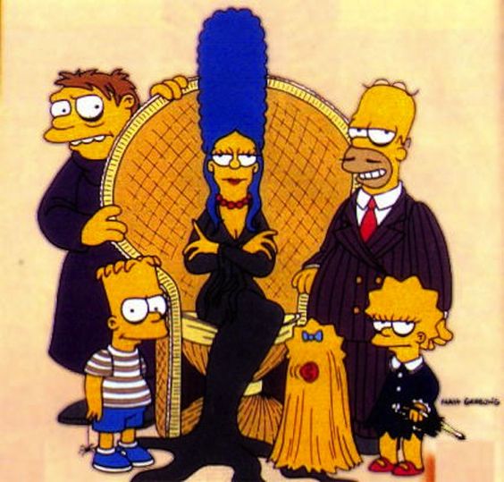 The Simpsons family in formal clothing posed together on a couch
