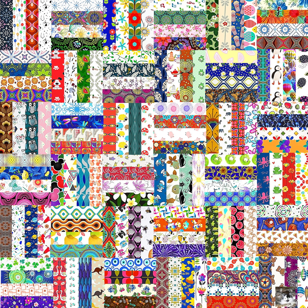 Colorful patchwork quilt with interlocking fabric strips in various patterns and bright colors