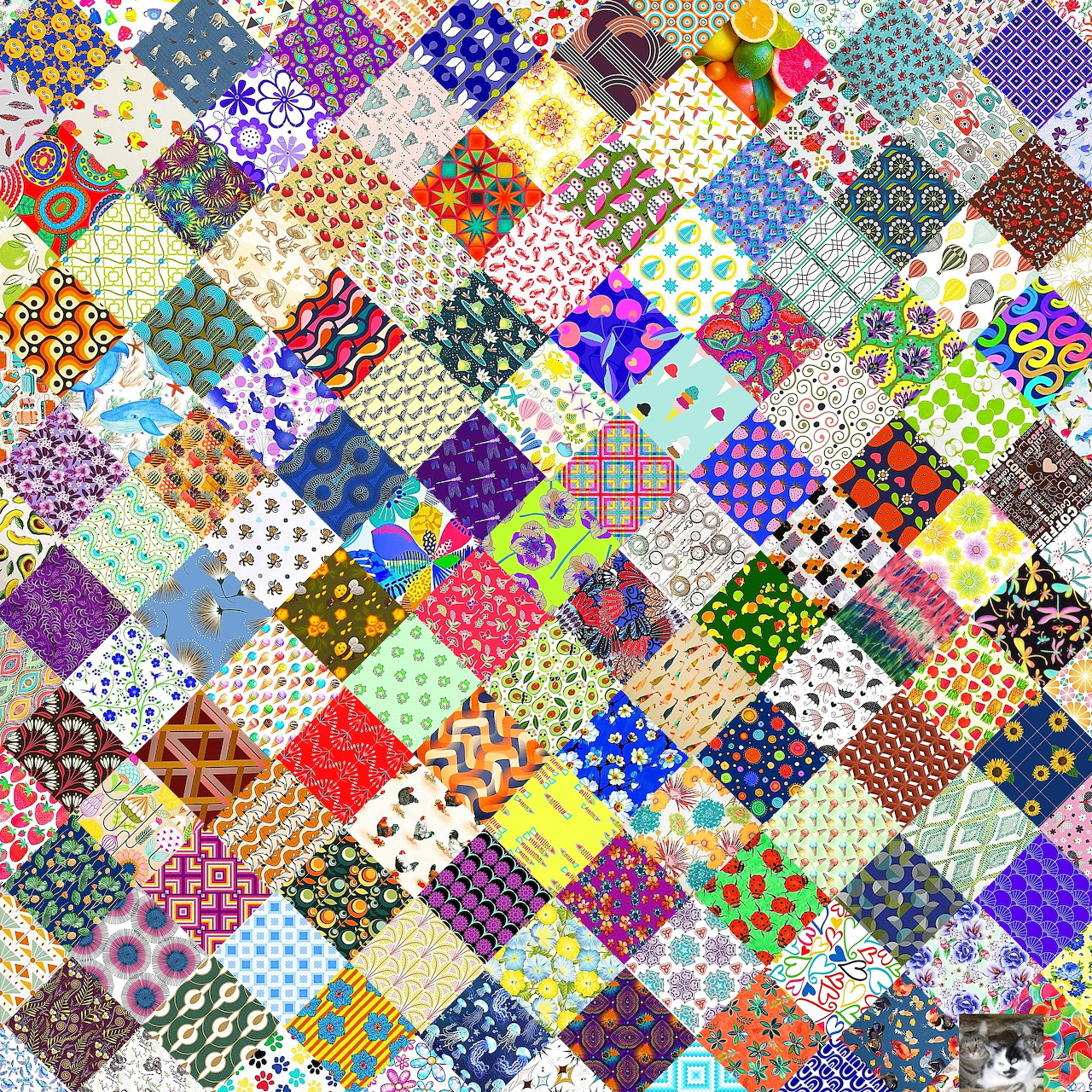 Colorful patchwork quilt with varied geometric, floral, and abstract patterns arranged in a grid of small squares