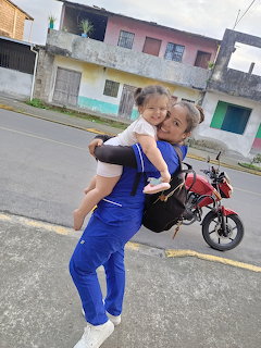 Woman Holding Child Outdoors