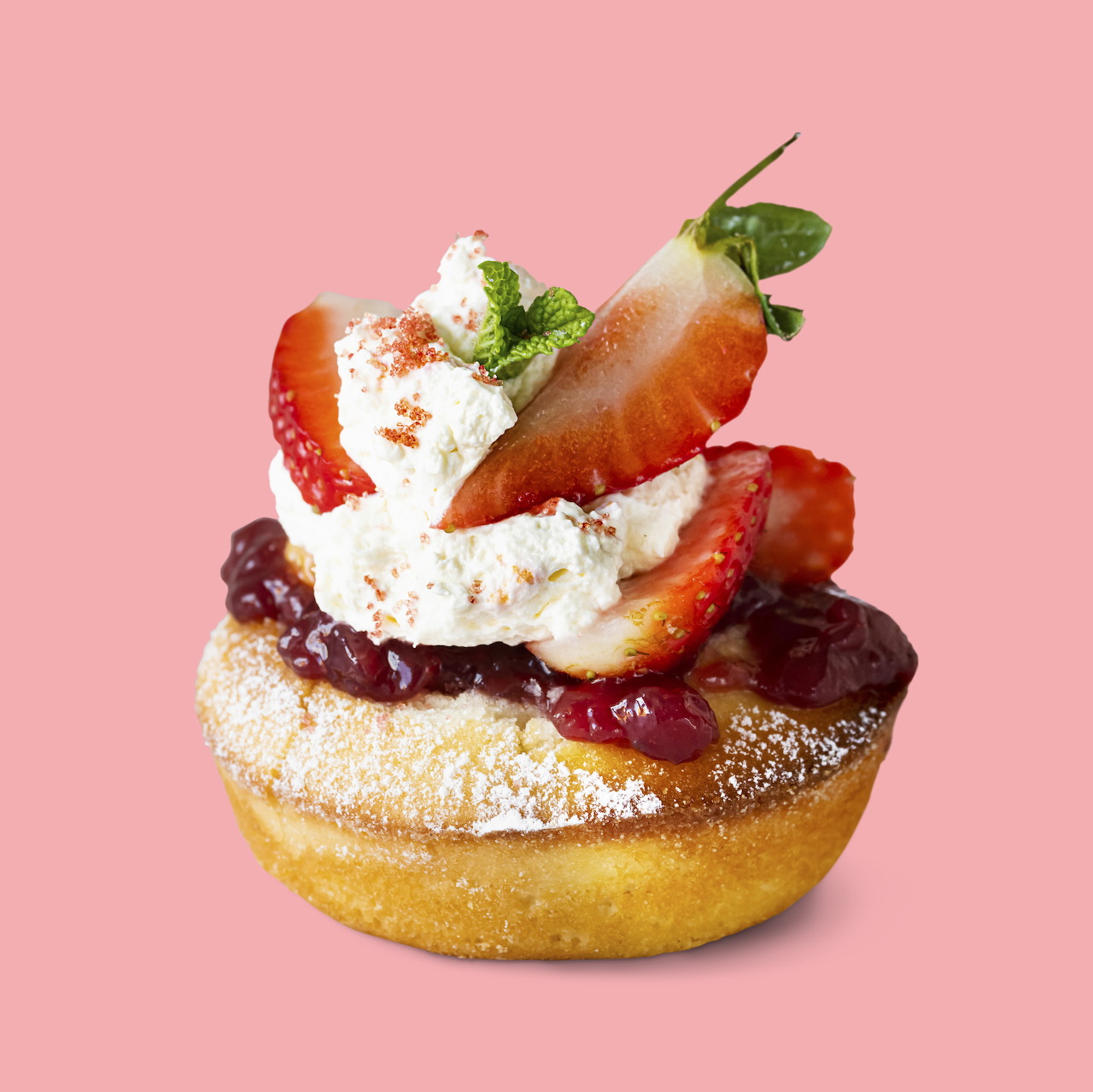 Strawberry shortcake dessert with cream and fresh berries on pink background