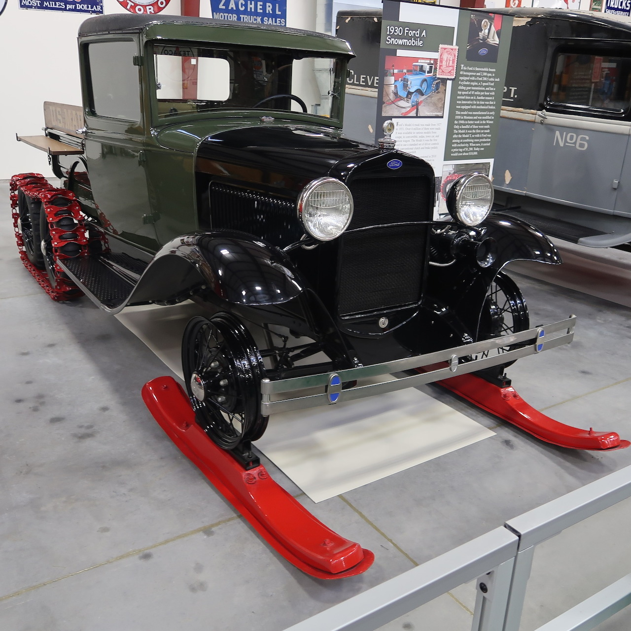 Vintage 1930 Ford Model A snowmobile conversion with red skis on display indoors