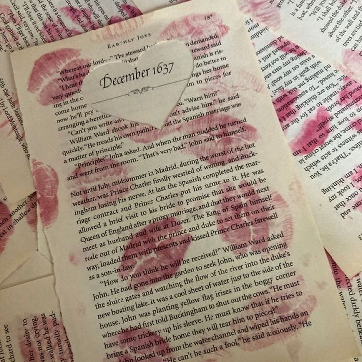 Aged book page with December 1637 heading and pink lipstick kiss prints on text