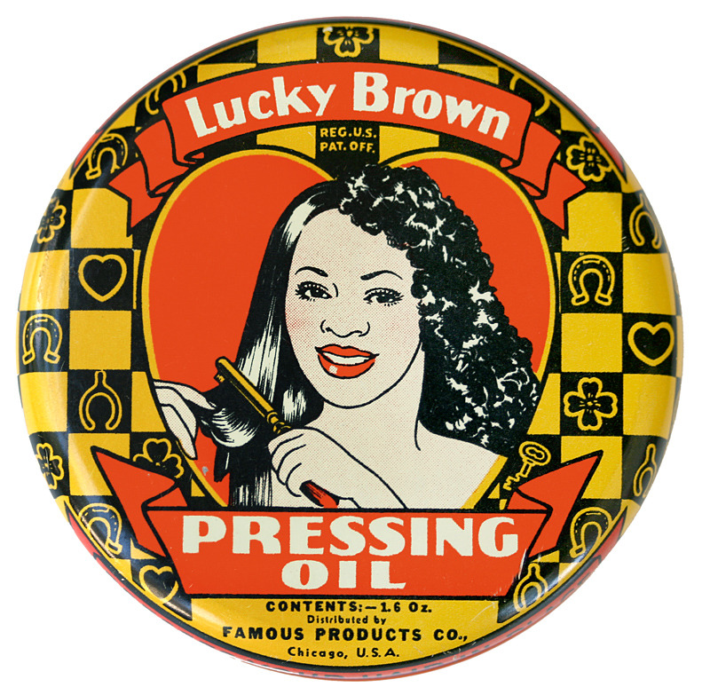 Vintage Lucky Brown Pressing Oil round tin lid with illustrated woman and hairbrush