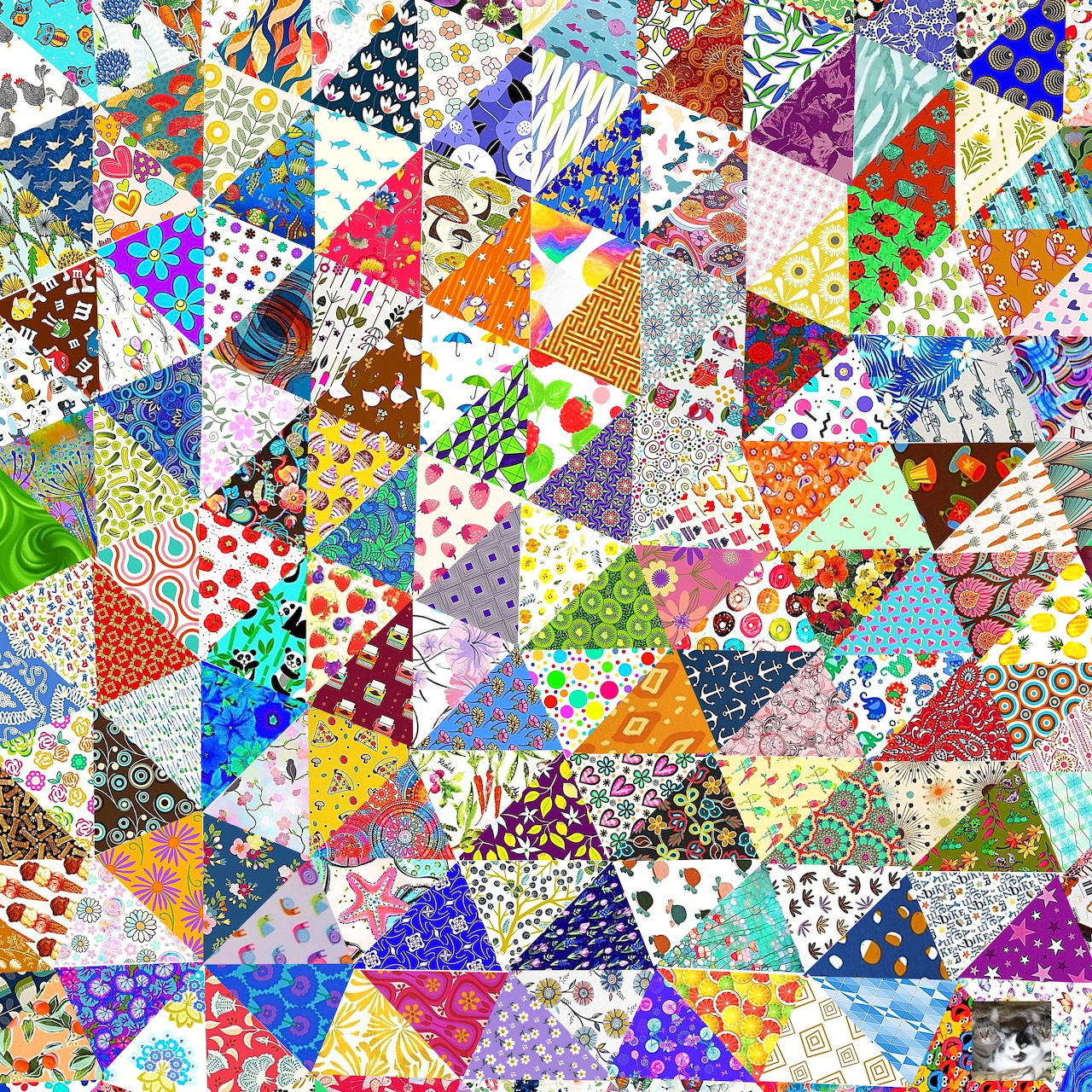 Colorful patchwork quilt made of small triangular fabric pieces with various patterns and bright colors