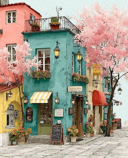 Colorful European street with teal building, shop awnings, flower boxes, and pink cherry blossom trees