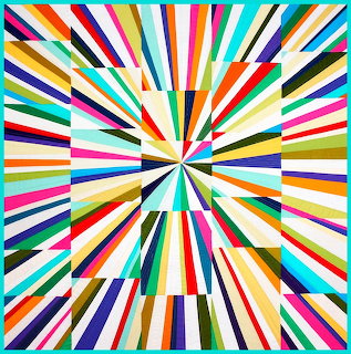 Colorful quilt with radiating strips in starburst pattern, rainbow colors on white background