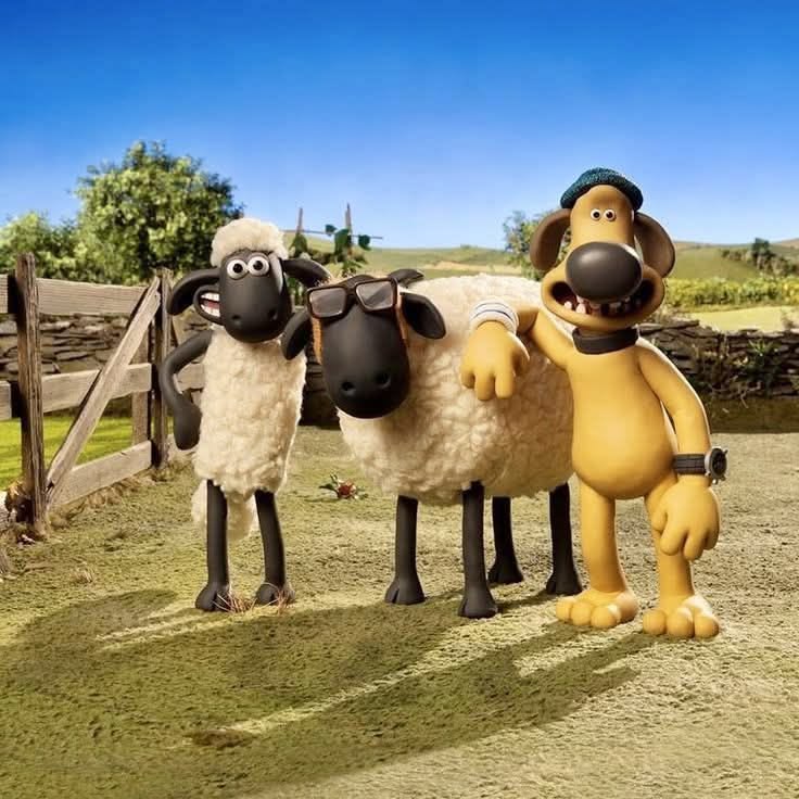 Shaun the Sheep cartoon characters posed together on a sunny farm path with pastoral landscape background