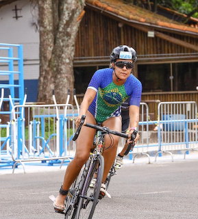 Woman Cycling in Triathlon
