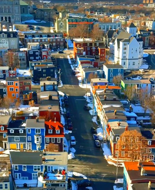 Aerial view of colorful row houses in St. John's, Newfoundland with blue, orange, yellow and red buildings