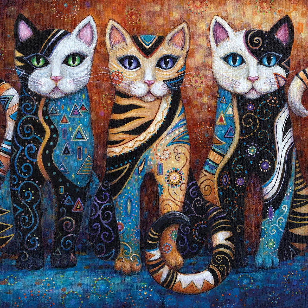Three decorative cats with elaborate patterns, jewelry and colorful ornamental designs sitting together