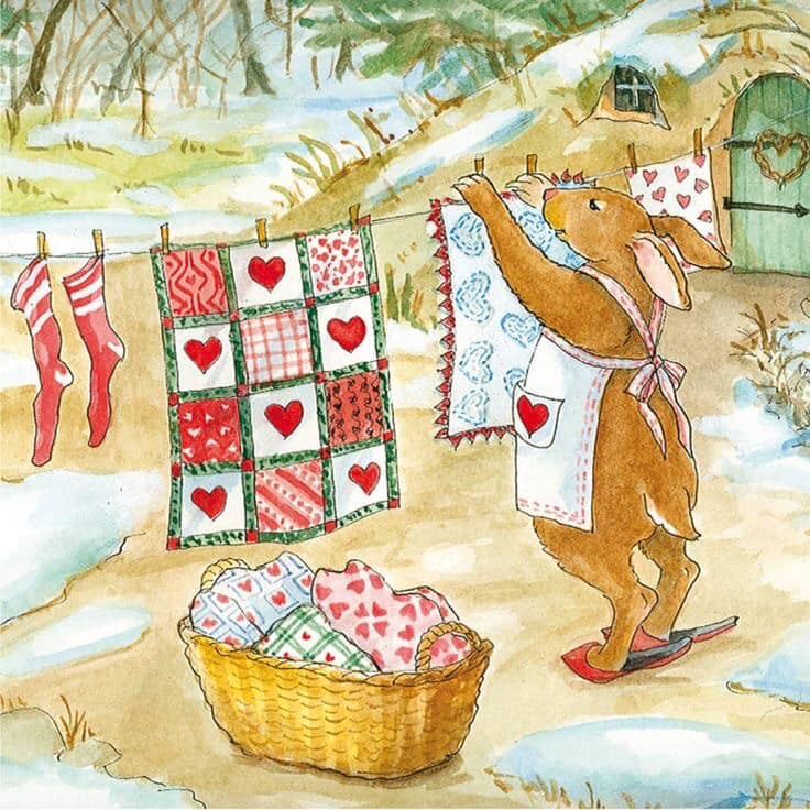 Watercolor rabbit hanging heart quilts and stockings on clothesline in snow near cottage