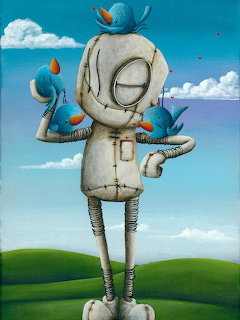 Whimsical stitched rag doll with blue birds standing on green hills under a cloudy sky