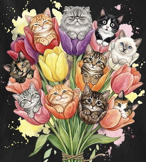 Cute kittens sitting inside colorful tulip flowers in a bouquet arrangement