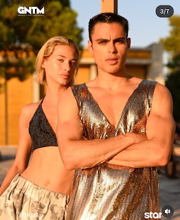 Male and female models posing in gold metallic outfits during golden hour sunset