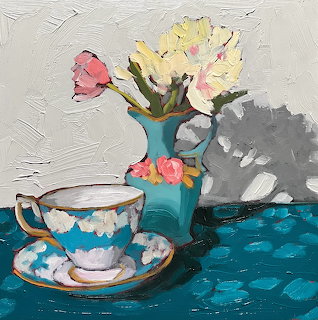 Painted still life with ornate teacup and vase of roses on blue patterned cloth