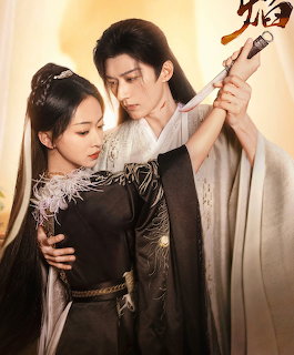 Man and woman in traditional robes holding a sword in a close dramatic pose