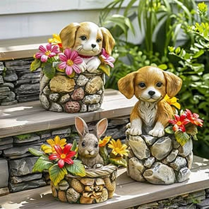 Stone animal planters shaped like two puppies and a rabbit on garden steps with colorful flowers