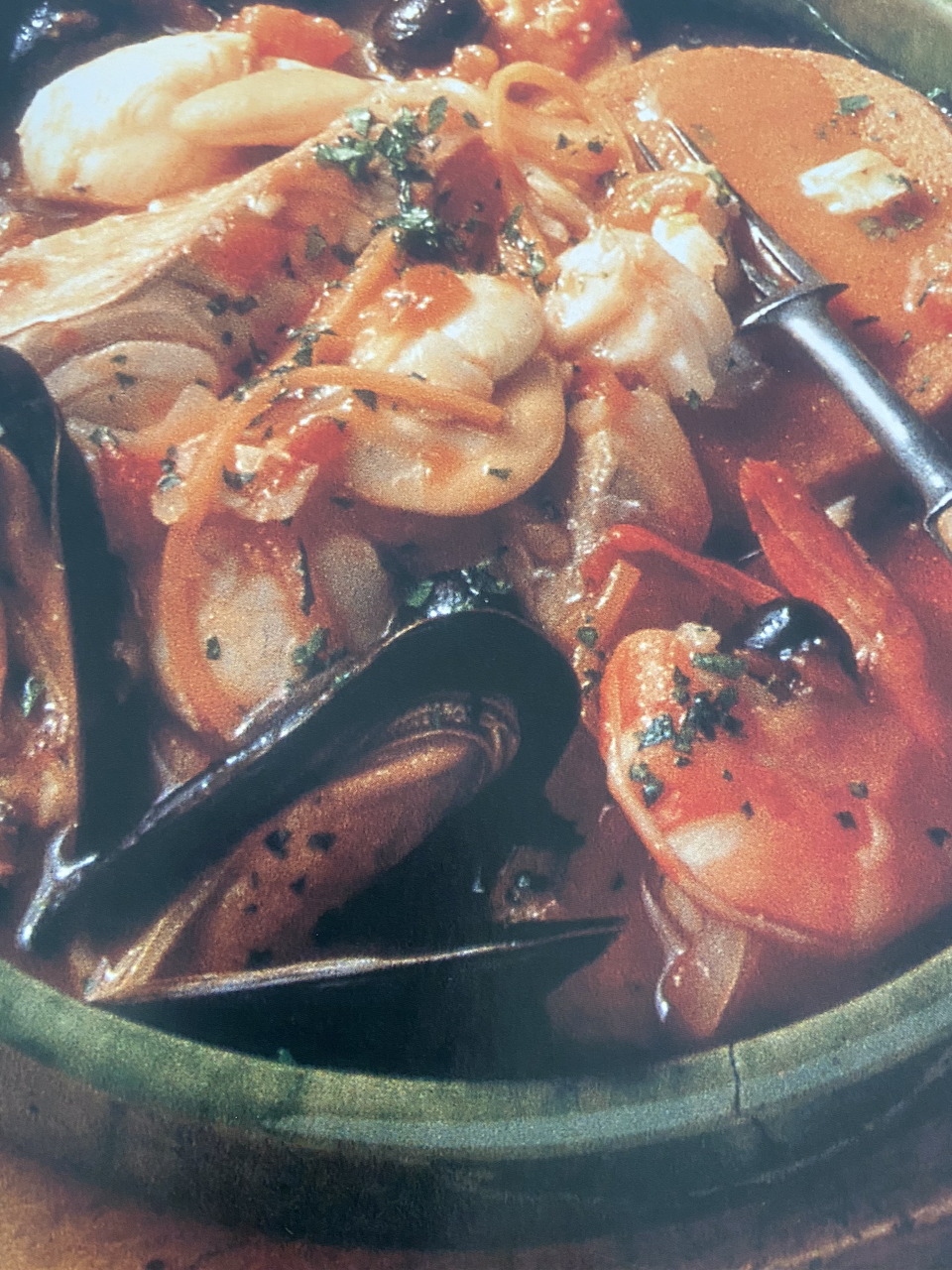 Bowl of Sicilian seafood stew with shrimp, mussels and tomato broth