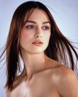 Portrait of Keira Knightley with windblown brown hair and bare shoulders