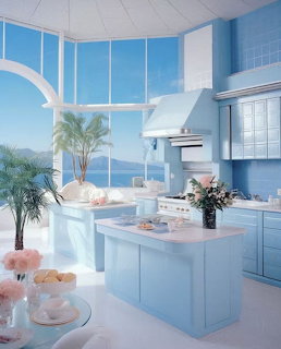 Pastel blue kitchen interior with large windows overlooking a sunny beach and ocean