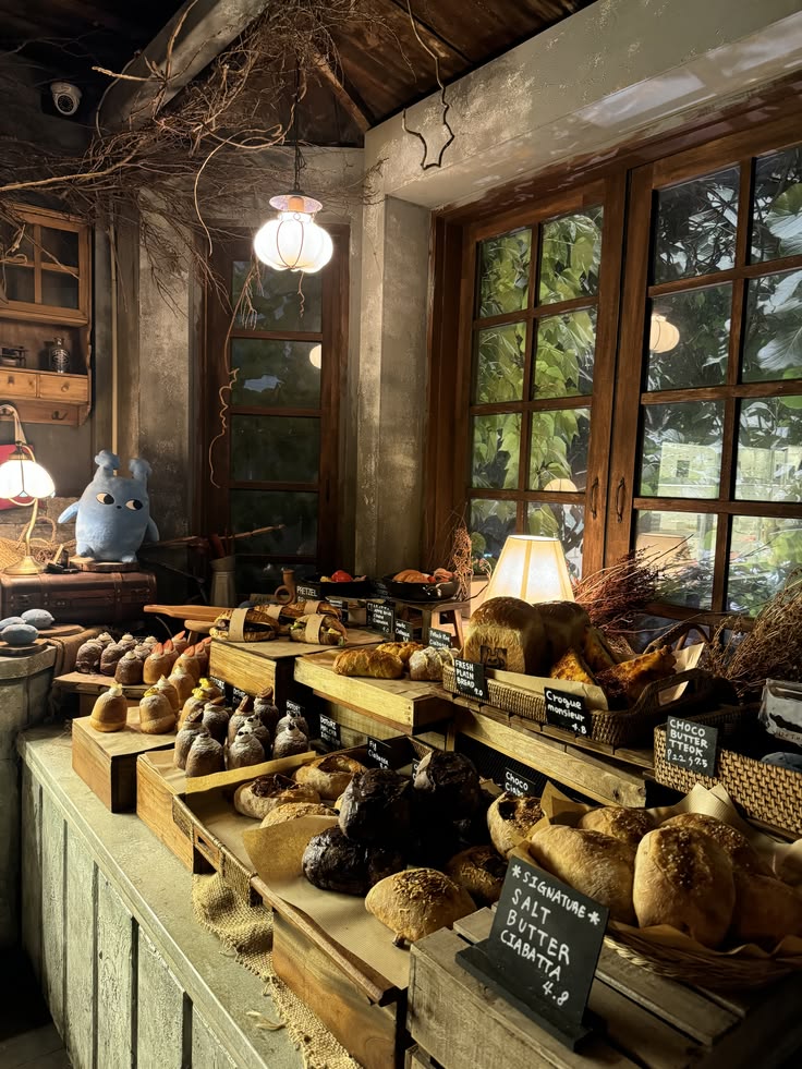 Rustic cafe interior with wooden shelves, bread display, and natural window light