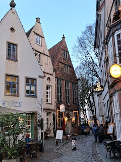Historic cobblestone street with old gabled houses in Bremen Schnoor