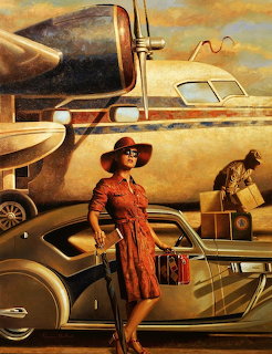 Woman in red vintage dress and hat stands by classic car with propeller airplane behind in warm golden tones