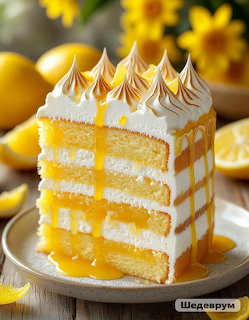 Tall lemon layer cake with white meringue peaks, yellow sponge layers, and lemon curd filling on a white plate