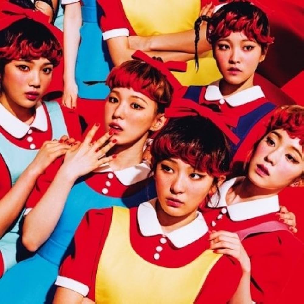 Five young women in matching colorful outfits posing closely together