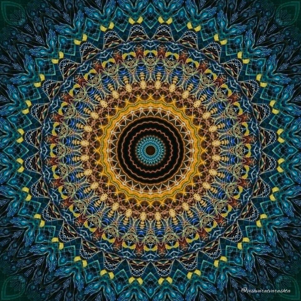 Ornate mandala with golden center radiating into blue geometric patterns