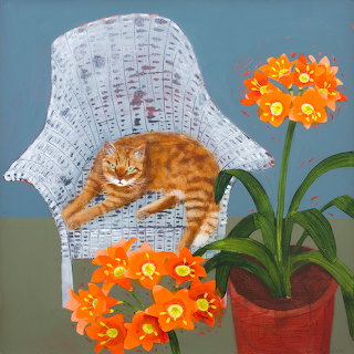 Ginger Cat on Wicker Chair
