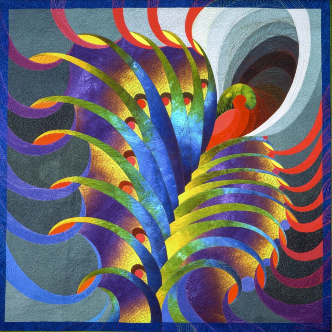 Colorful abstract art quilt with swirling feather design in rainbow hues on blue-gray textured background