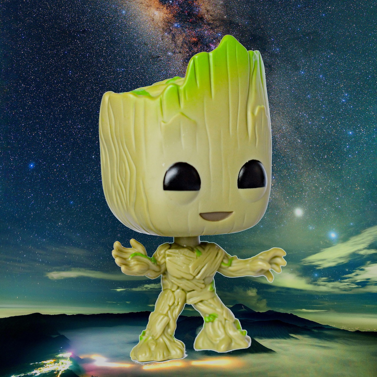 Baby Groot Funko Pop figure with large black eyes against a starry night sky background