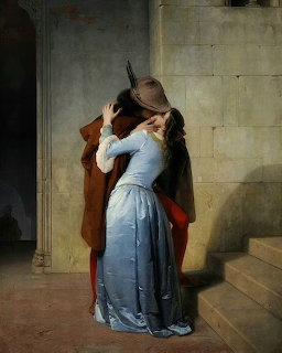 Painting of a man in a brown cloak kissing a woman in a blue silk dress on stone steps