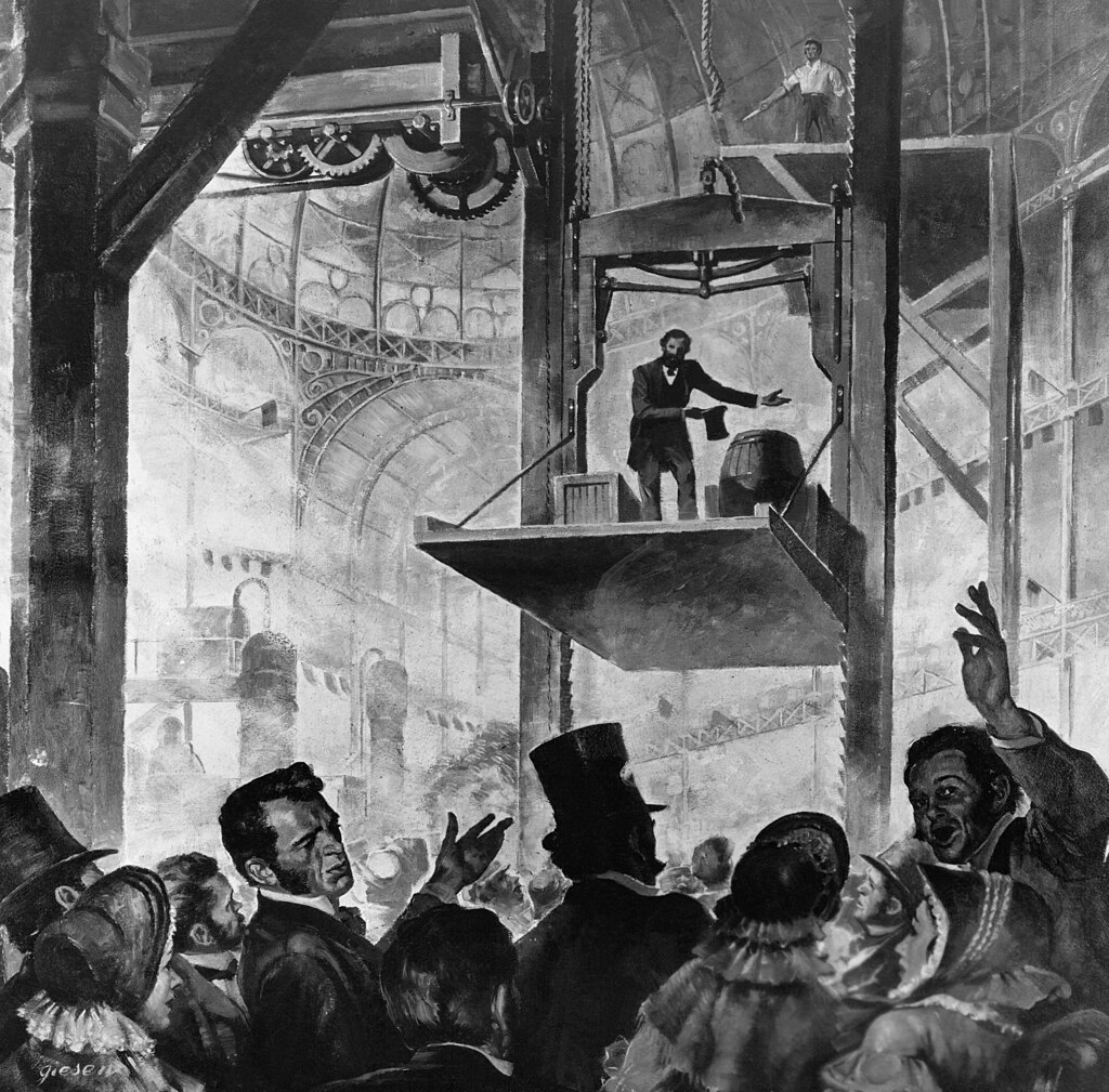 Black and white illustration of man demonstrating safety elevator on platform with crowd watching below