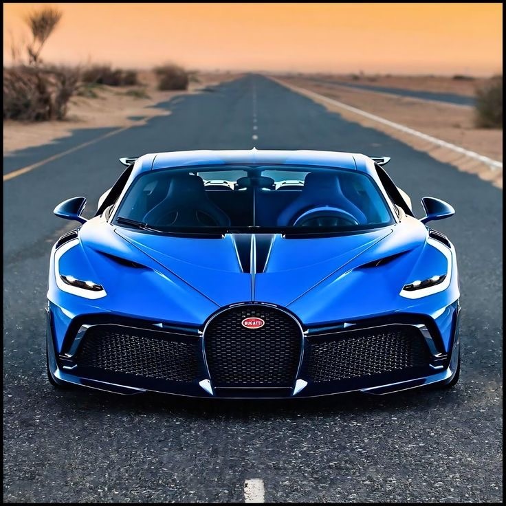 Front view of blue Bugatti supercar on desert highway at golden hour