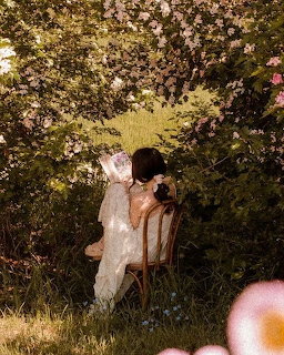 Woman Reading in Garden