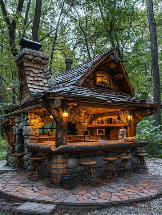Rustic wooden cottage with stone chimney and glowing lights in a forest