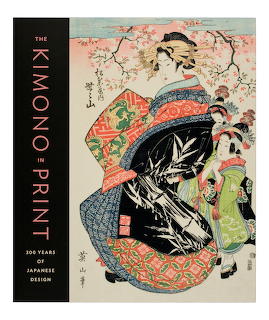 Book cover with Japanese woodblock print of women in colorful kimonos under cherry blossom branches