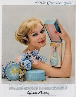 Vintage ad showing woman with Elizabeth Arden Blue Grass perfume bottles and blue packaging
